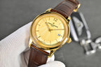 Vacheron Constantin watch with gold-tone case, white dial, brown leather strap