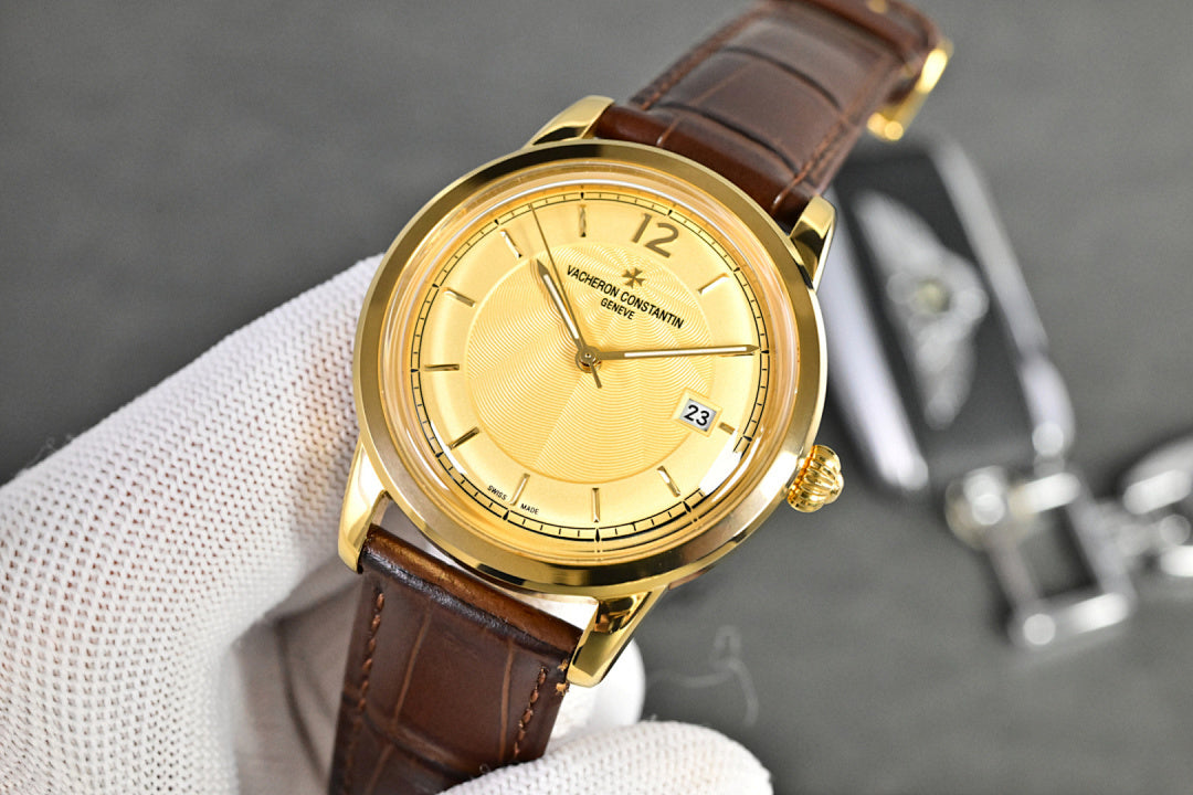 Vacheron Constantin watch with gold-tone case, white dial, brown leather strap