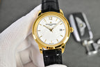 Vacheron Constantin watch with gold-tone case, white dial, black leather strap