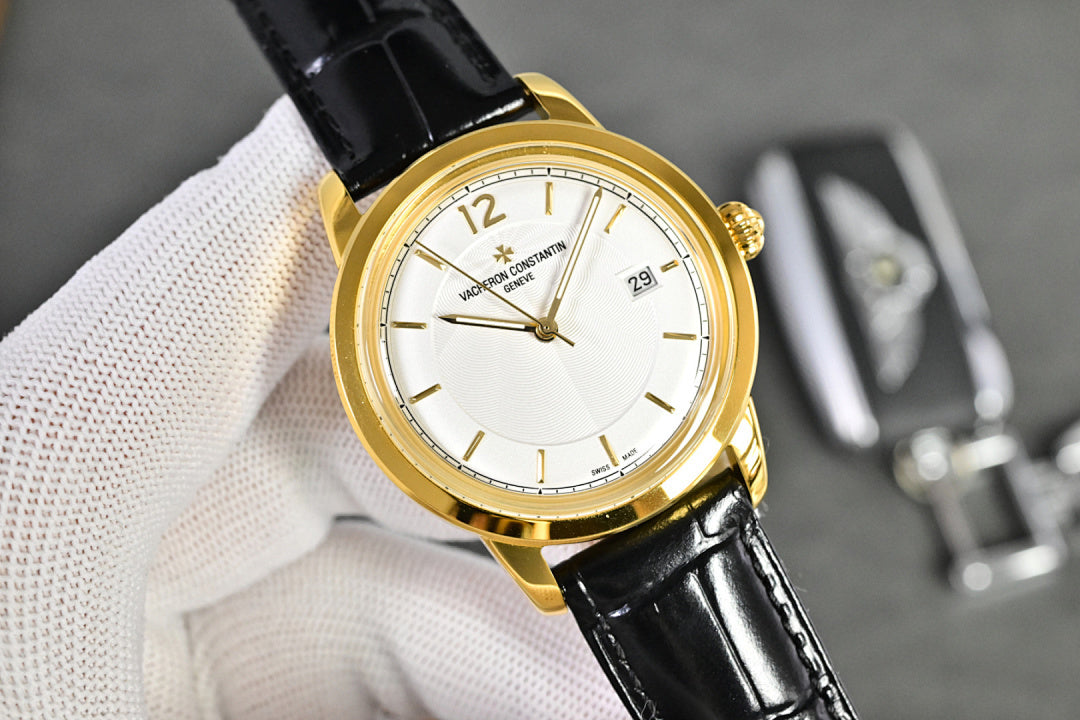 Vacheron Constantin watch with gold-tone case, white dial, black leather strap