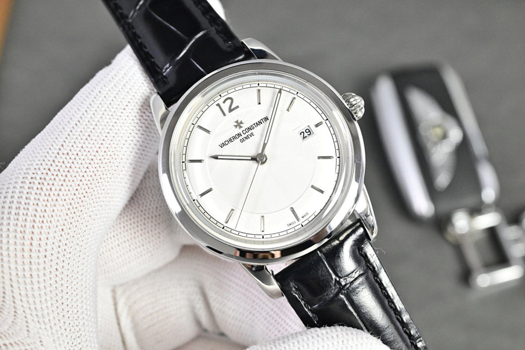 Vacheron Constantin watch with silver-tone case, white dial, black leather strap