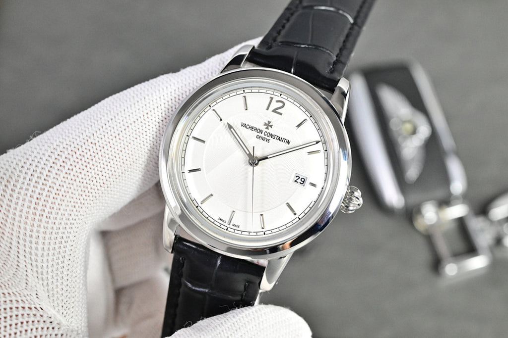 Vacheron Constantin watch with silver-tone case, white dial, black leather strap