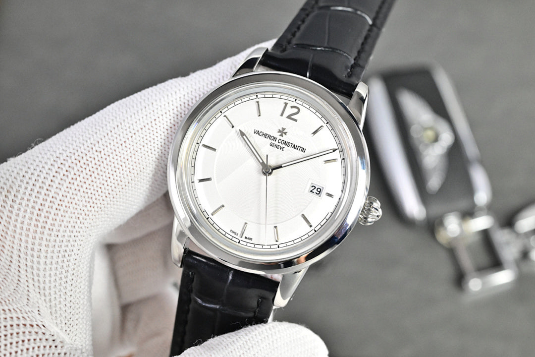Vacheron Constantin watch with silver-tone case, white dial, black leather strap