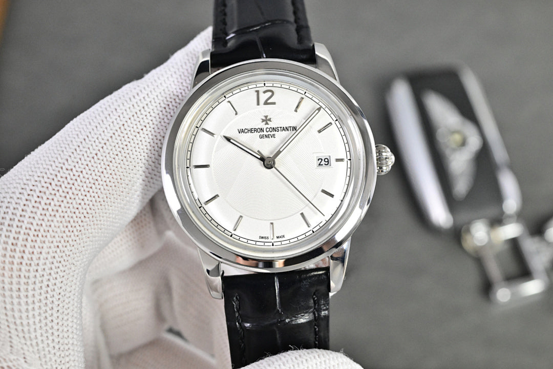 Vacheron Constantin watch with silver-tone case, white dial, black leather strap