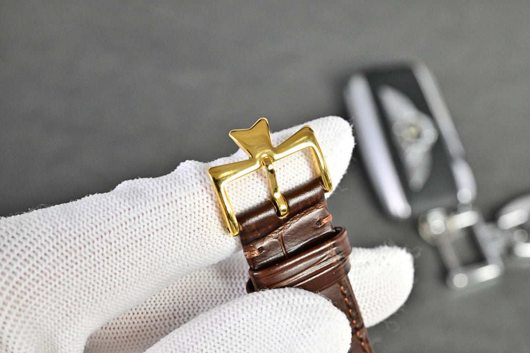 Vacheron Constantin watch with gold-tone caseback and brown leather strap