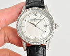 Vacheron Constantin watch with white dial and diamond-studded bezel on black leather strap