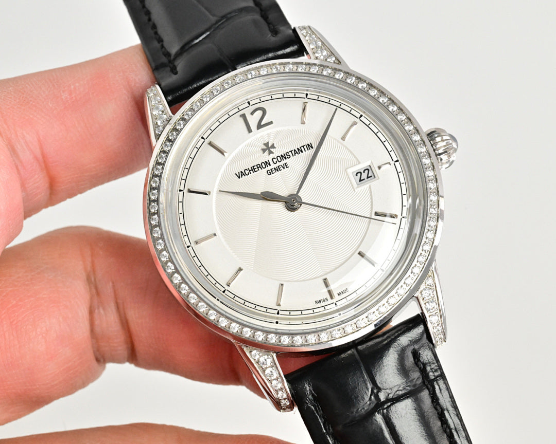 Vacheron Constantin watch with white dial and diamond bezel, black leather strap
