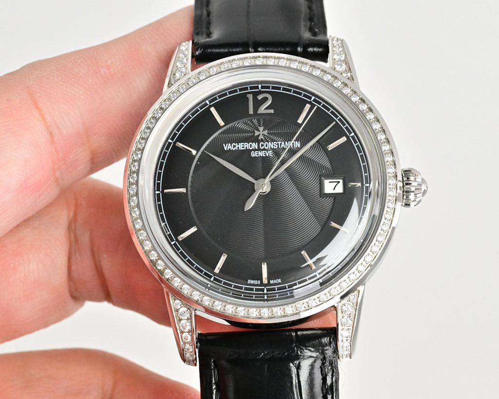 Vacheron Constantin watch with black dial, diamond bezel, black leather strap, face-on view
