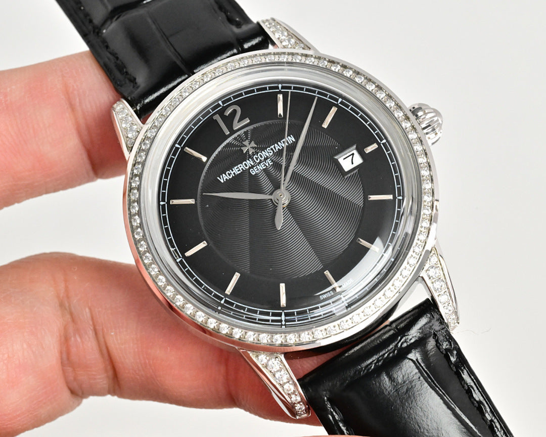 Vacheron Constantin watch with black dial and diamond bezel, black leather strap, angled view