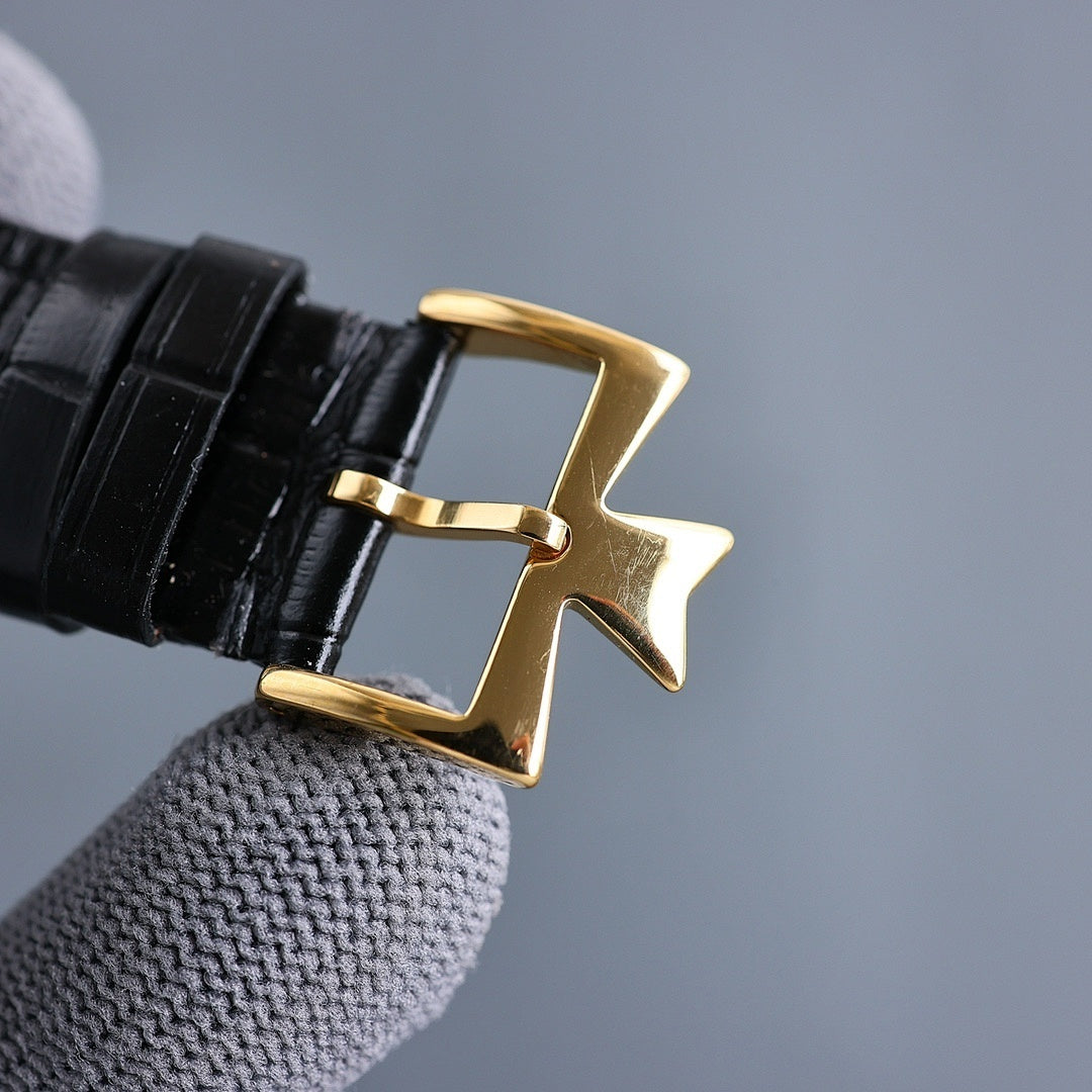 Vacheron Constantin watch buckle clasp with gold-toned hardware on black leather strap