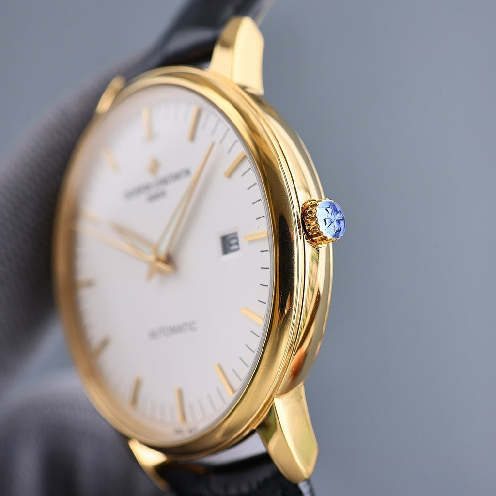 Vacheron Constantin automatic wristwatch in gold tone with blue gemstone crown, black leather strap