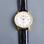 Vacheron Constantin automatic wristwatch with gold case, white dial, black leather strap