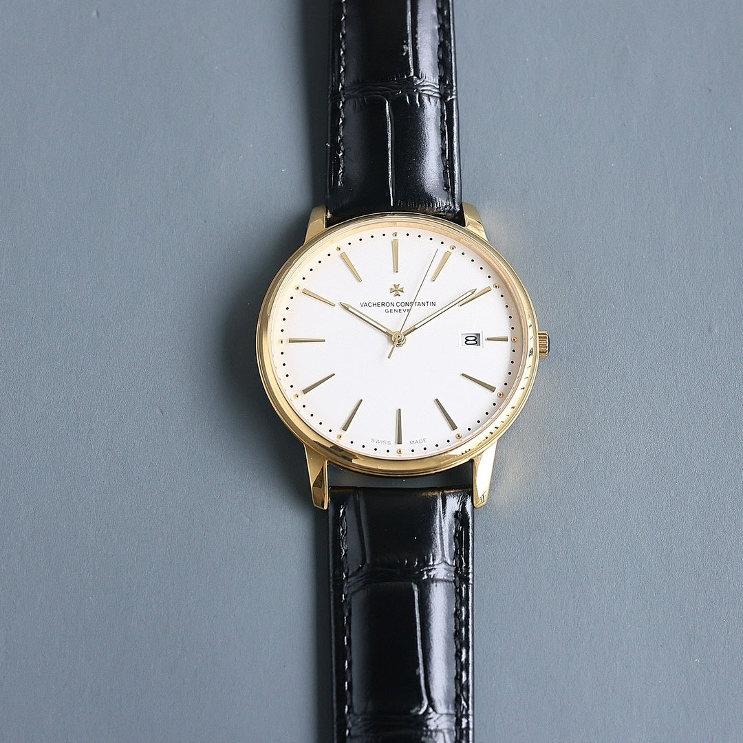 Vacheron Constantin wristwatch: white dial, black leather strap, gold case, date at 8.