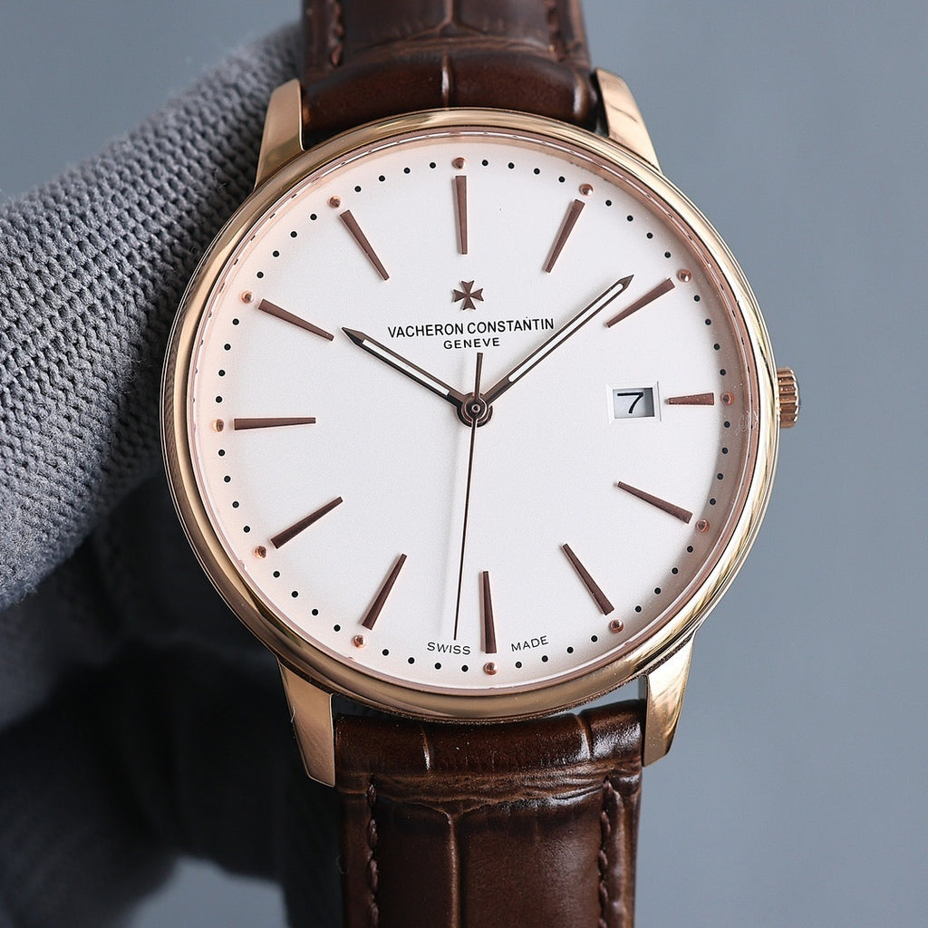 Vacheron Constantin wristwatch: white dial, brown leather strap, gold case, date at 7.
