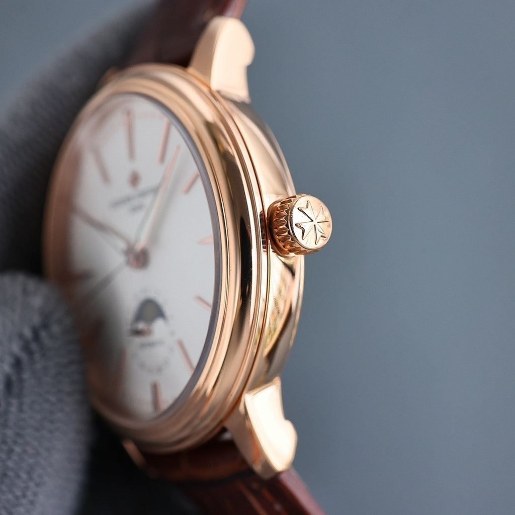 Vacheron Constantin gold-tone watch with brown leather strap, crown detail and white dial