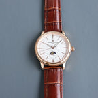 Vacheron Constantin automatic watch with white dial, moonphase, and brown leather strap