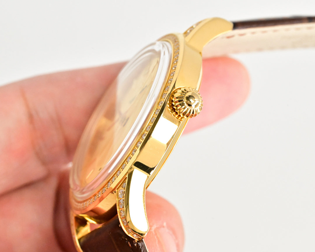 Gold-tone wristwatch side view with crown and brown leather strap