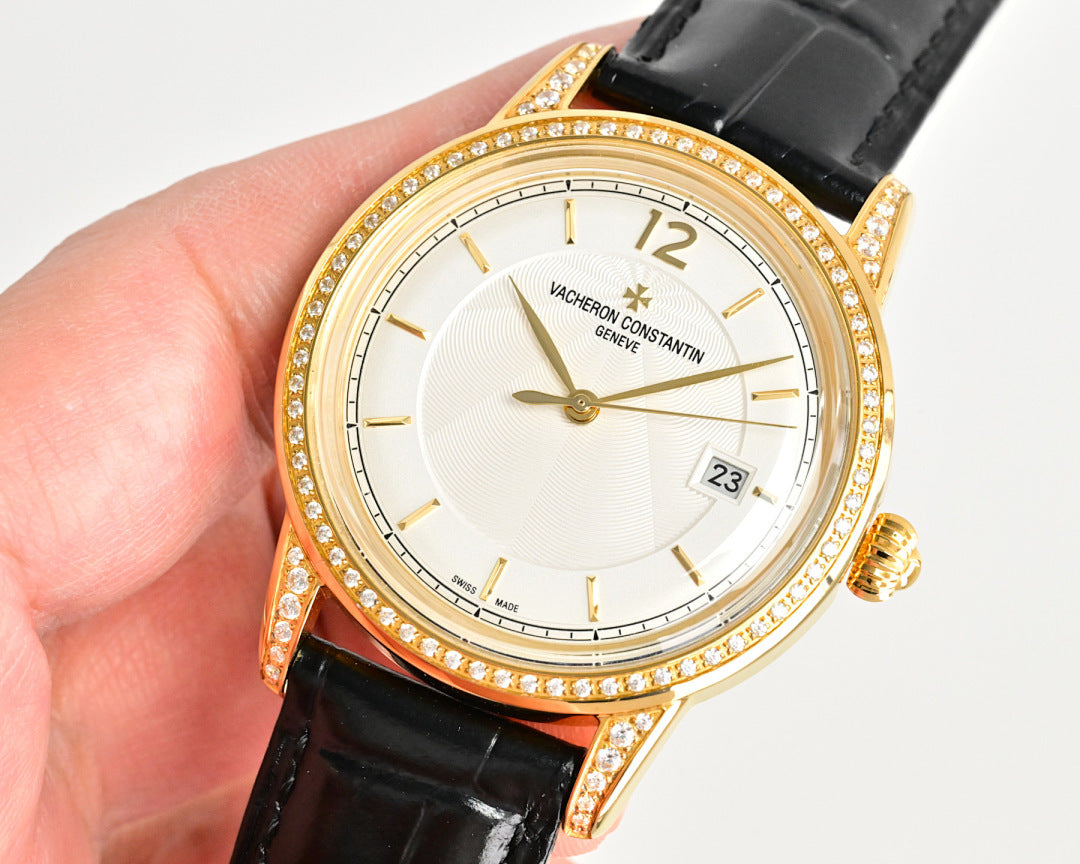 Gold-tone wristwatch with diamond bezel, black leather strap, white dial
