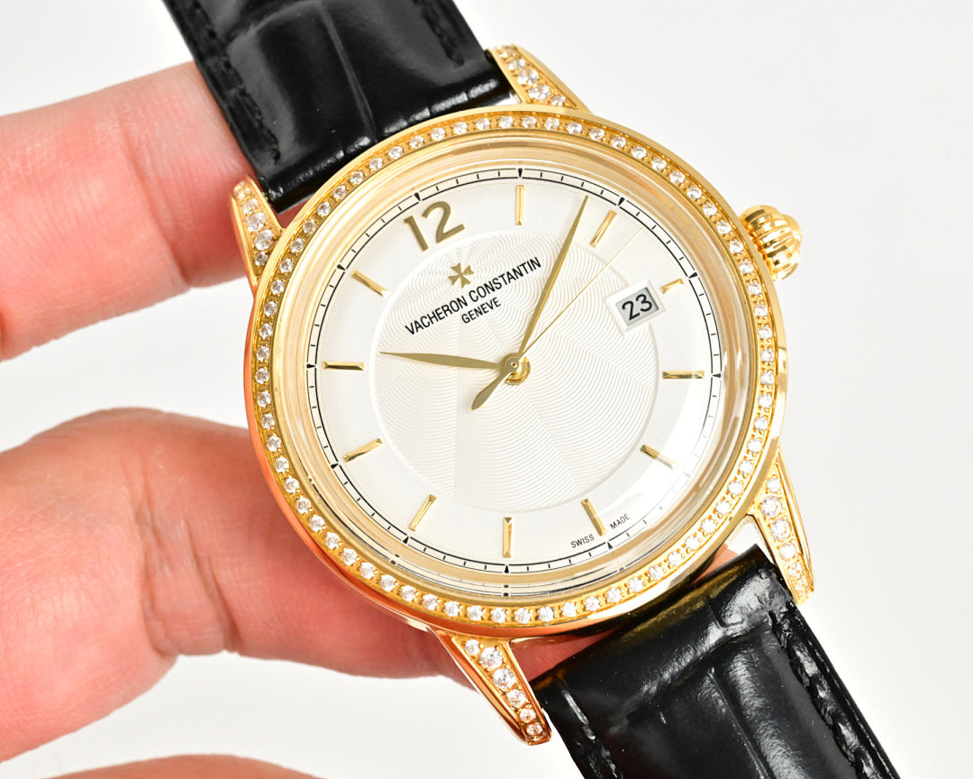 Gold-tone wristwatch with diamond bezel, black leather strap, white dial
