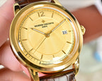 Gold-tone wristwatch with textured yellow dial and brown leather strap