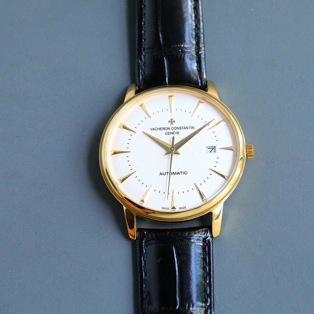 Vacheron Constantin wristwatch with white dial, gold case, black leather strap