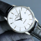 Automatic wristwatch with white dial, silver case, black leather strap, date window