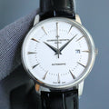 Automatic wristwatch with white dial, silver case, black leather strap, date window at 7