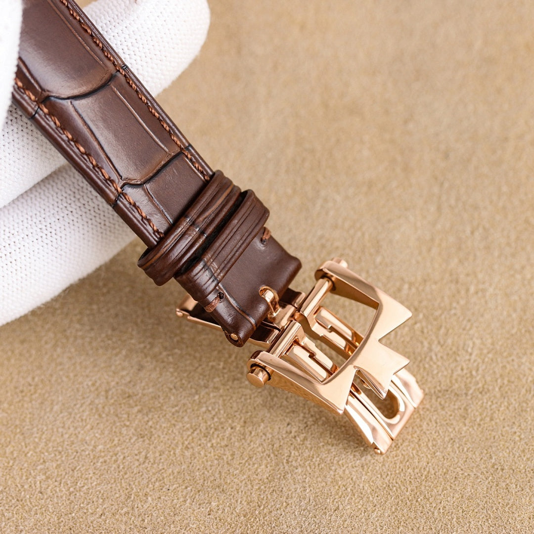 Vacheron Constantin watch clasp and brown leather strap with stitched detail, rose gold hardware
