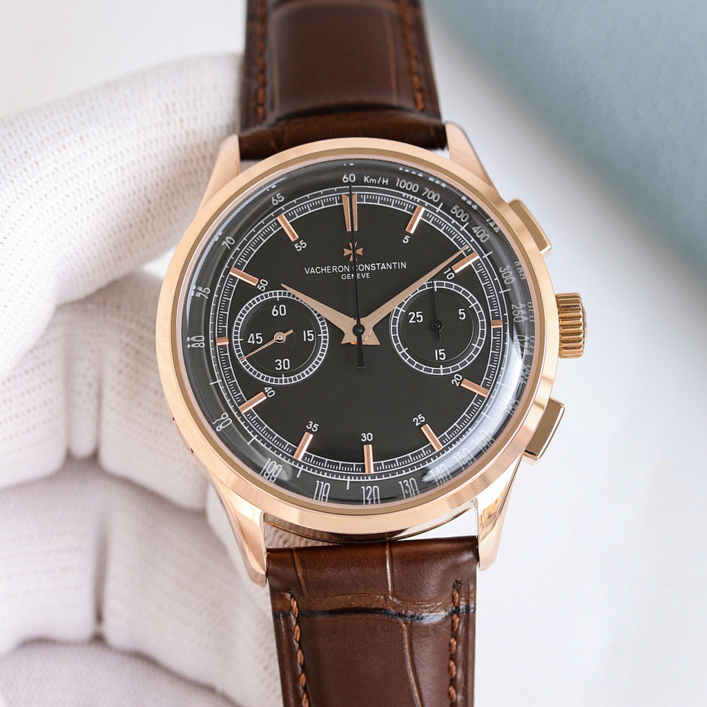 Round wristwatch with brown leather strap, rose gold case, black chronograph dial