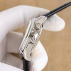 Vacheron Constantin watch side, brushed silver case with crown, black leather strap