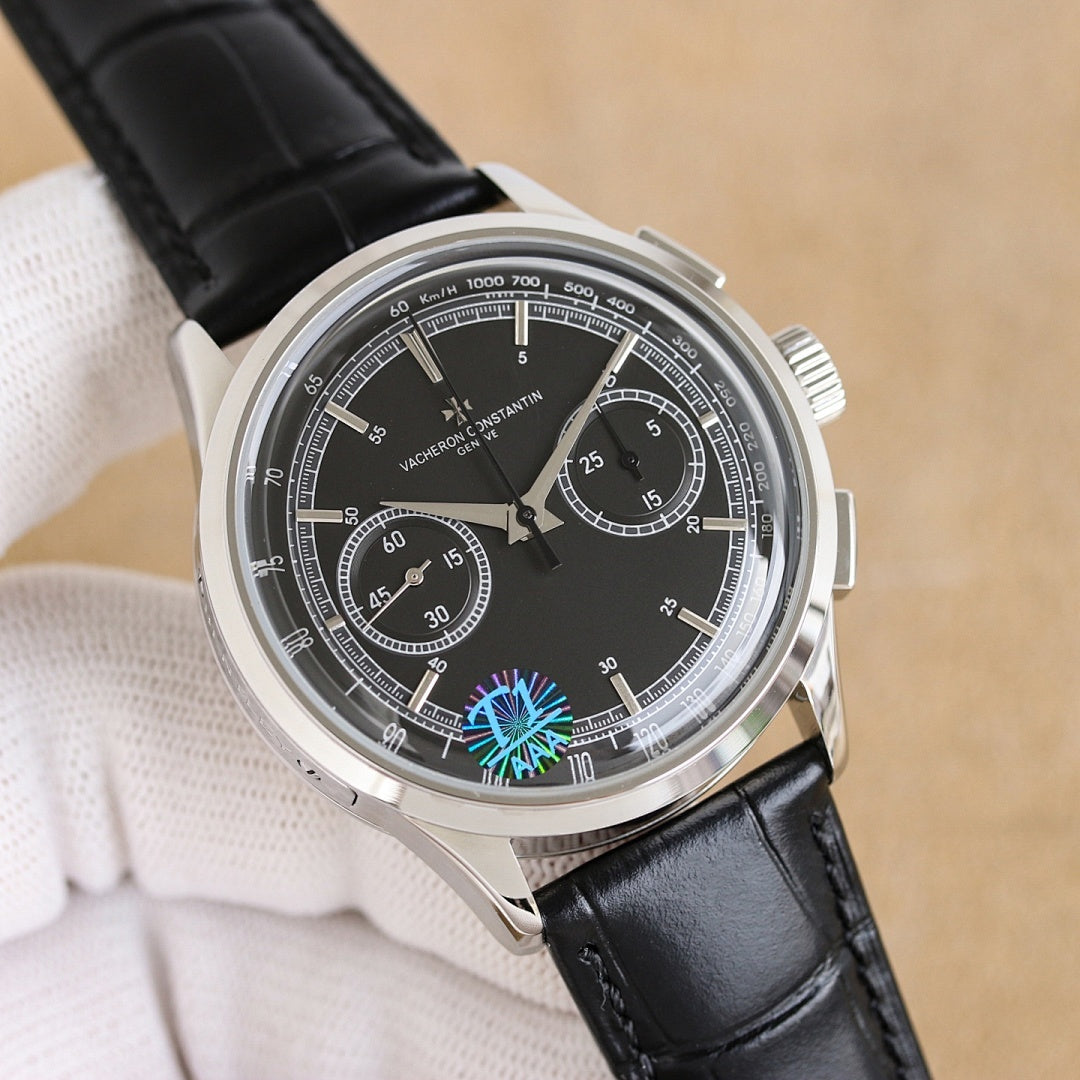 Vacheron Constantin watch, black dial with blue emblem, black leather strap, silver chronograph bezel