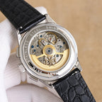 Vacheron Constantin watch case back, open movement with gold and silver details, black leather strap