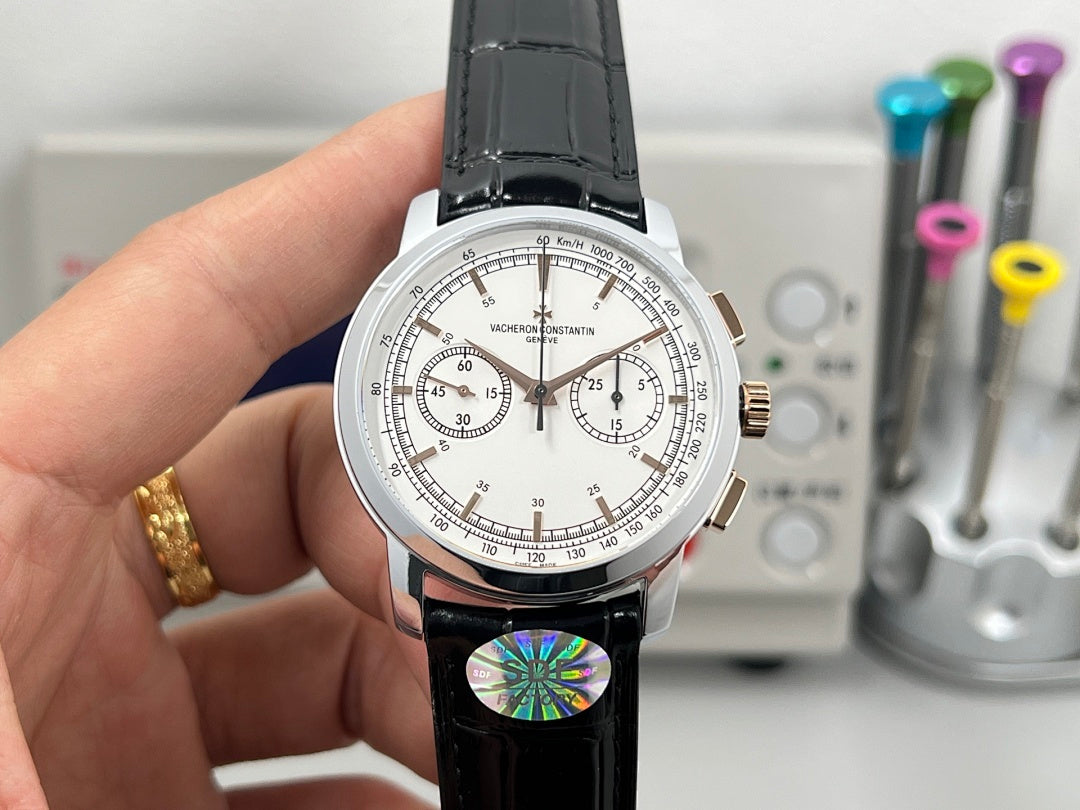 White dial chronograph wristwatch with black leather strap and rose-gold crown.