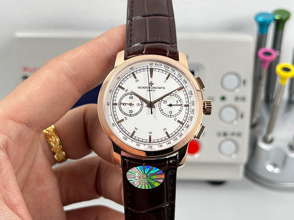 Rose gold tone chronograph watch with white dial, brown leather strap and pushers