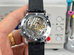 Vacheron Constantin wristwatch back view, exposed mechanical movement on black leather strap