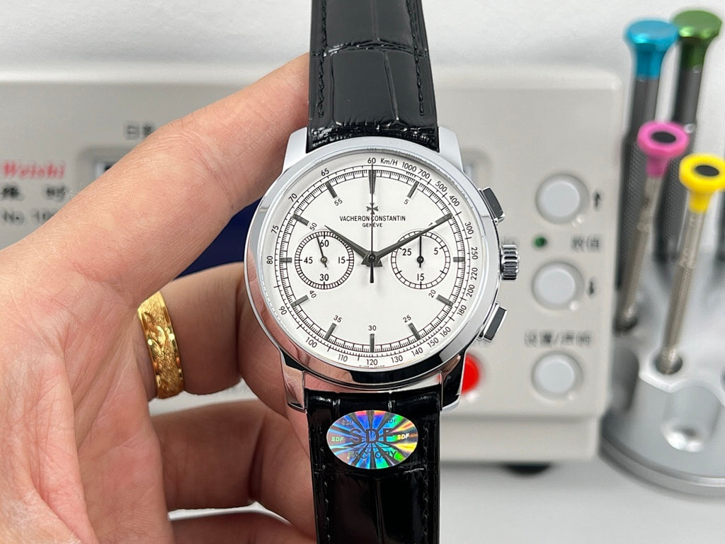 Vacheron Constantin wristwatch front close-up, white dial and black leather strap with subdials