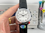 Vacheron Constantin wristwatch front close-up, white dial and black leather strap with subdials