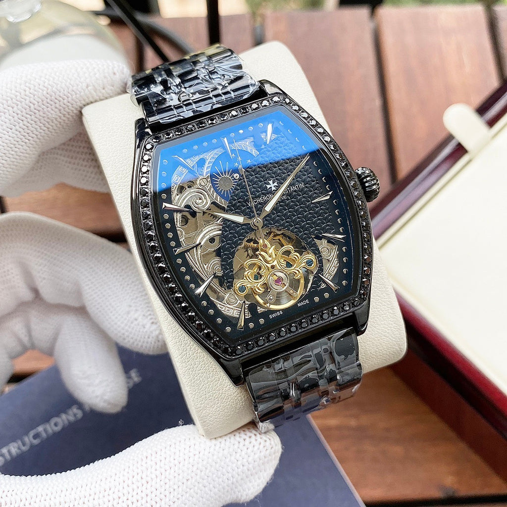 Black-toned automatic wristwatch with diamond bezel and blue skeleton dial