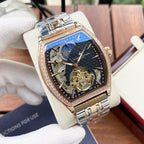 Gold-and-silver automatic wristwatch with diamond bezel and bright blue skeleton dial