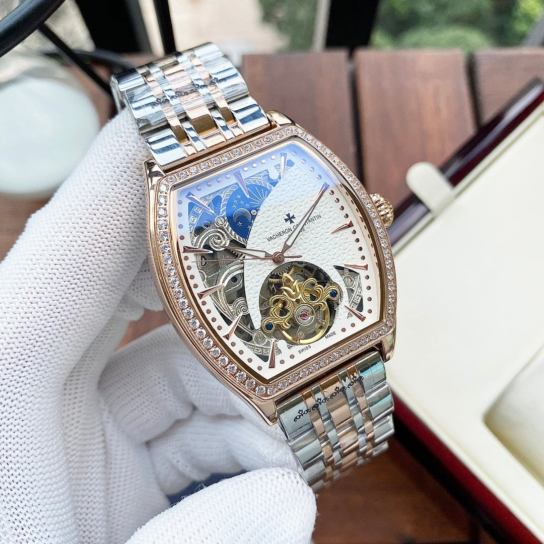 Gold-and-silver automatic wristwatch with diamond bezel and white skeleton dial