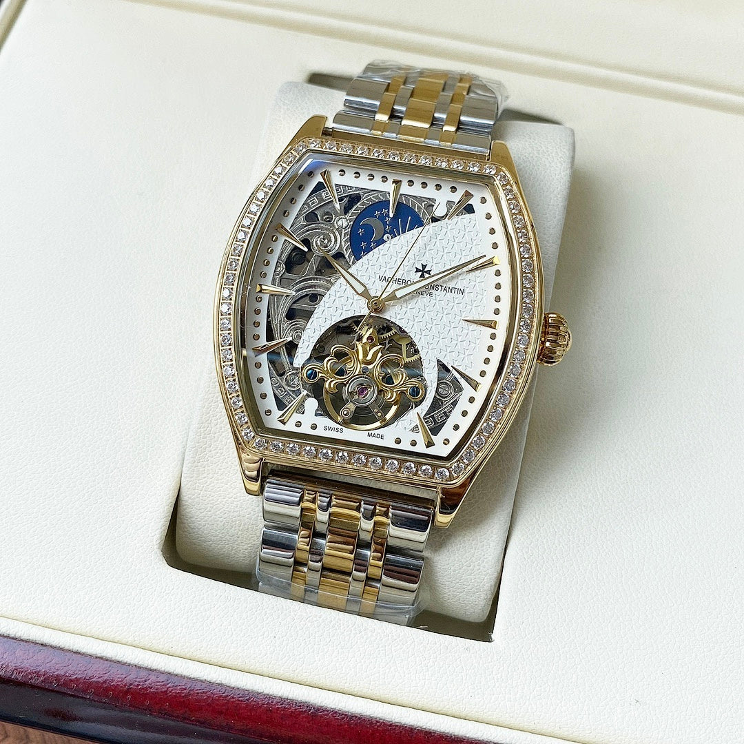 Gold-and-silver automatic wristwatch with diamond bezel and blue-and-white skeleton dial