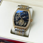 Gold-and-silver automatic wristwatch with diamond bezel and dark blue skeleton dial