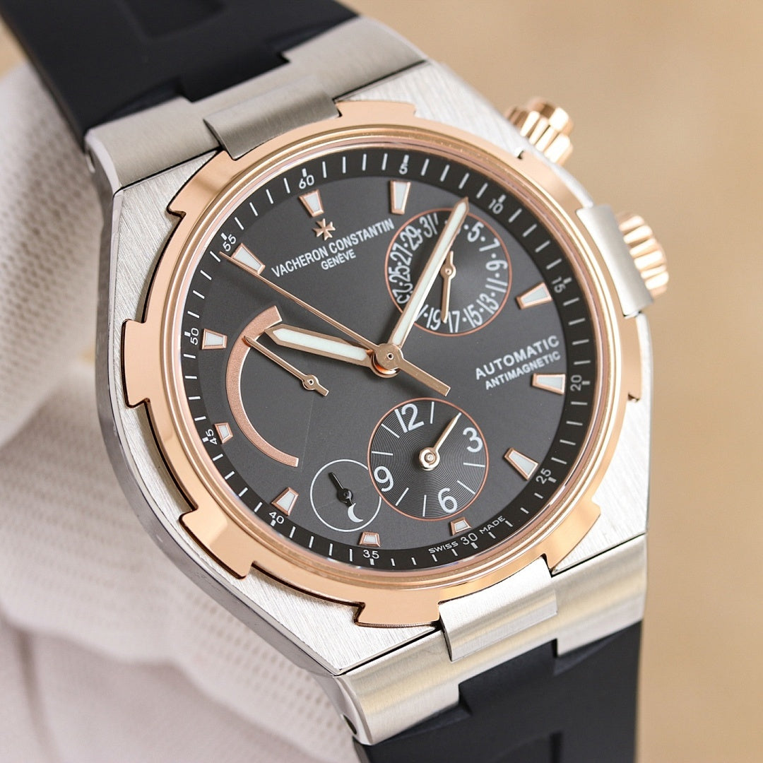 Vacheron Constantin wristwatch, steel case, dark dial, rose-gold accents, black rubber strap