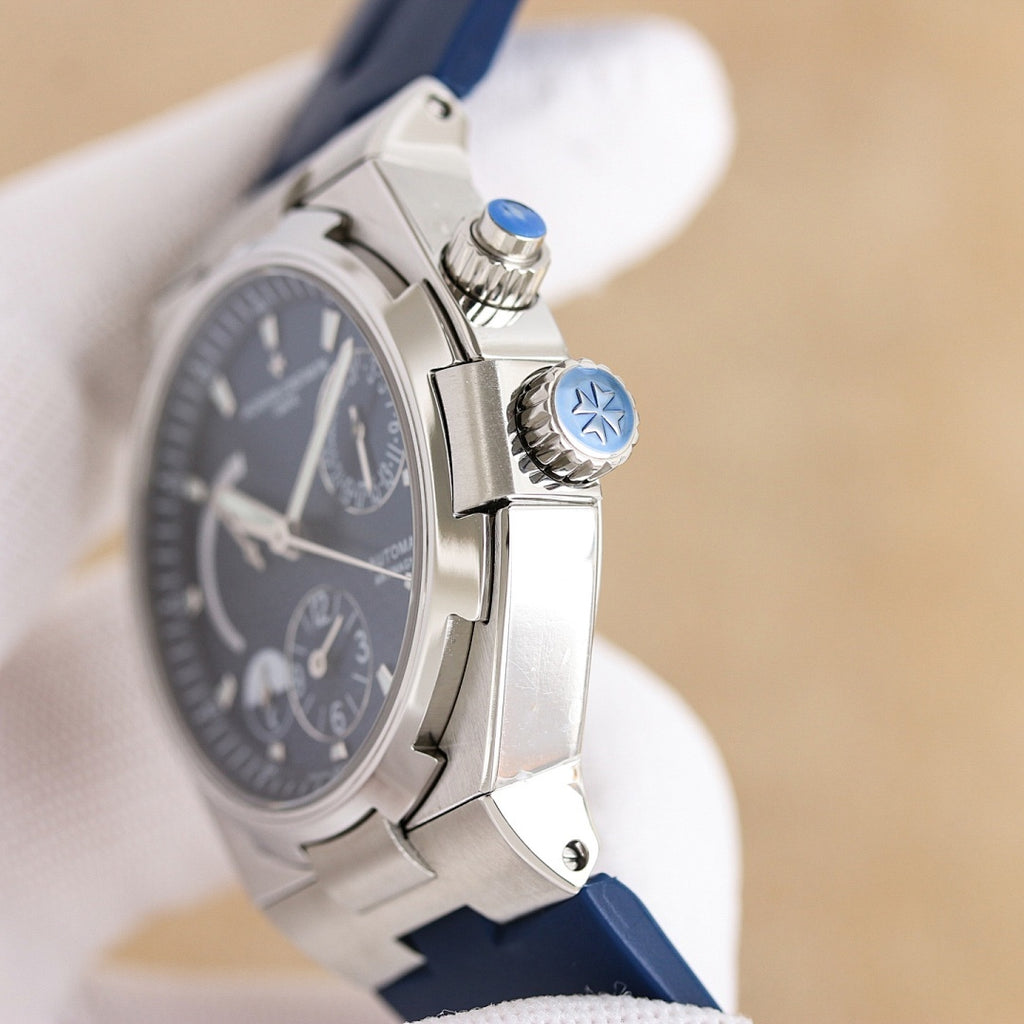Vacheron Constantin wristwatch, steel side with crown, dark dial, blue rubber strap