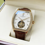 Wristwatch with white dial, gold-toned bezel, brown leather strap