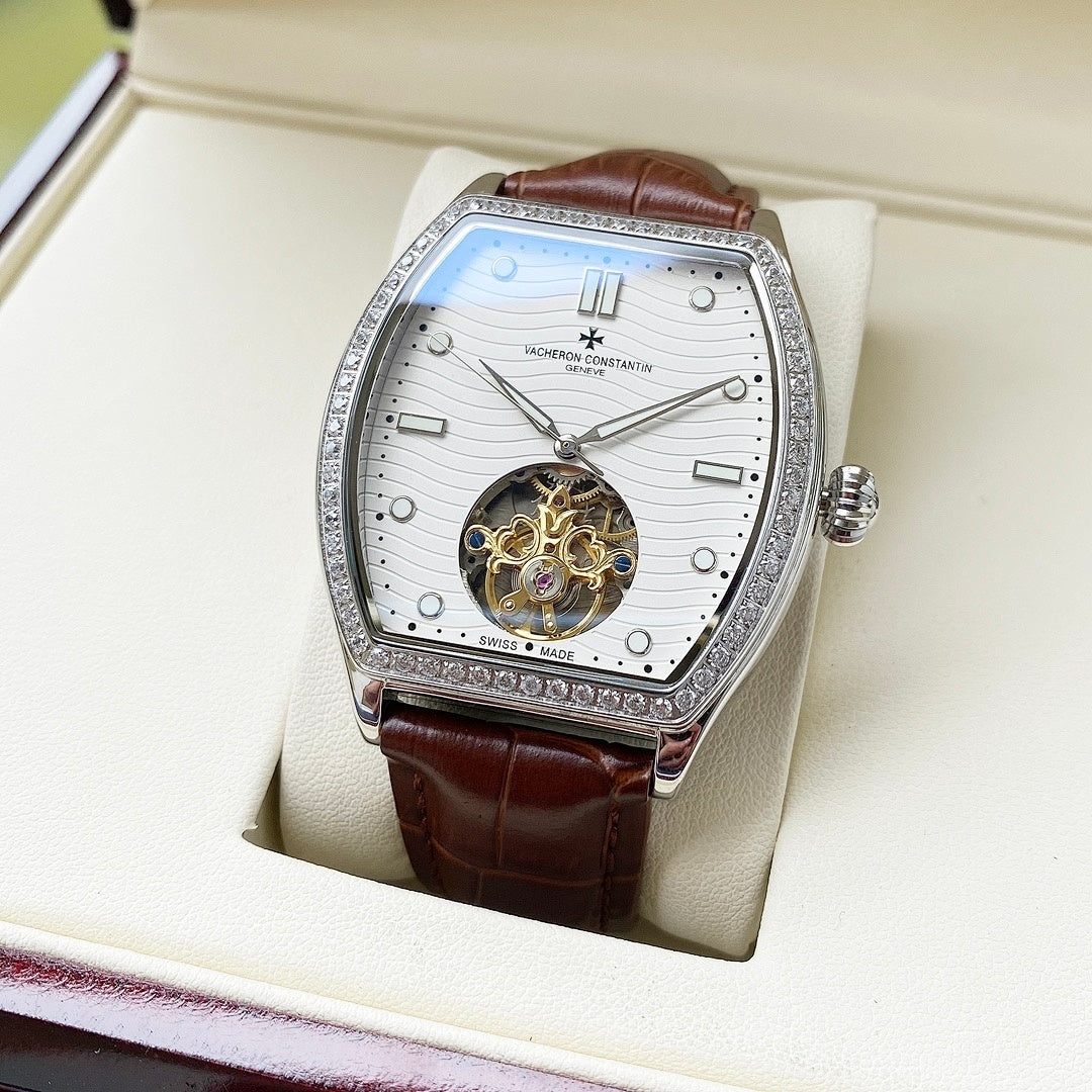 Wristwatch with white dial, jeweled silver bezel, brown leather strap