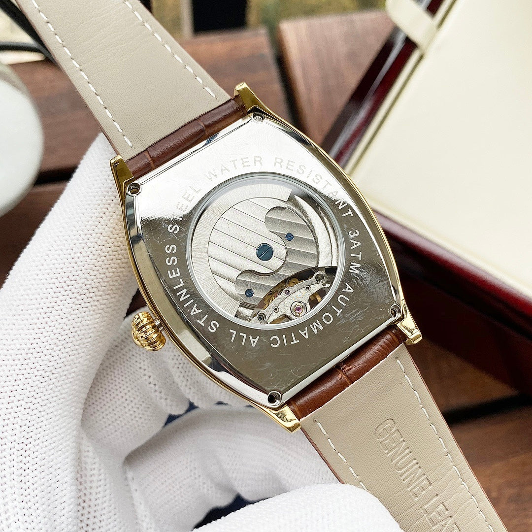 Wristwatch case back on brown leather strap, gold-tone with engraved text