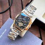 Two-tone men's wristwatch with dark blue dial, Roman numerals, and linked metal bracelet.