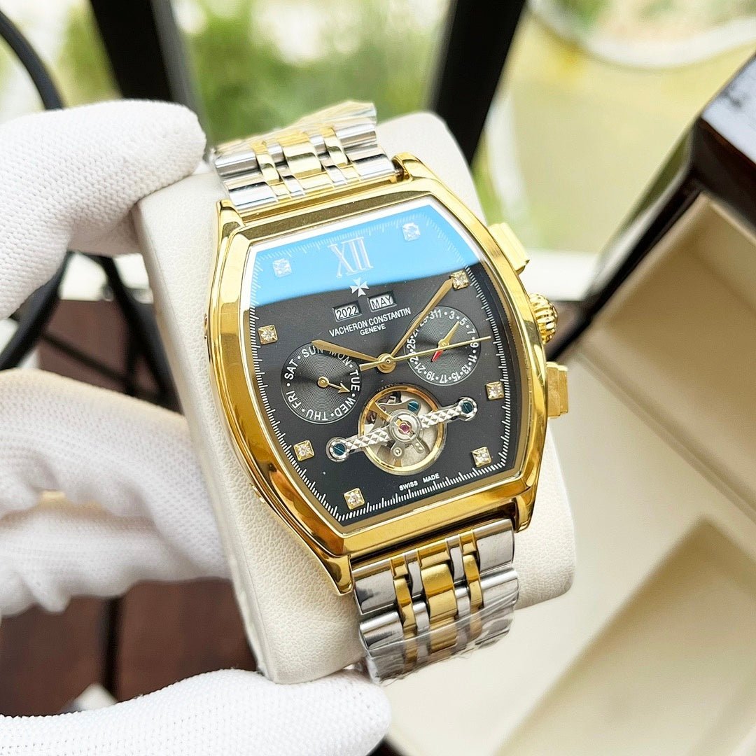 Two-tone men's wristwatch with blue dial and gold bezel on metal bracelet.