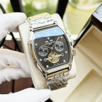 Two-tone men's wristwatch with blue dial, Roman numerals, and gold-accented movement.